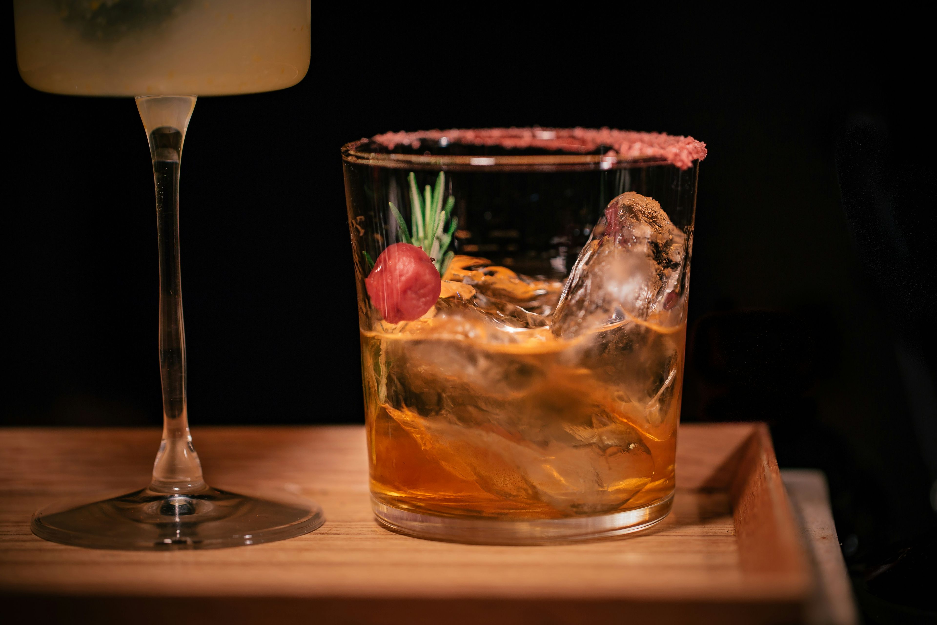Glass of cocktail with ice in the glass with garnish